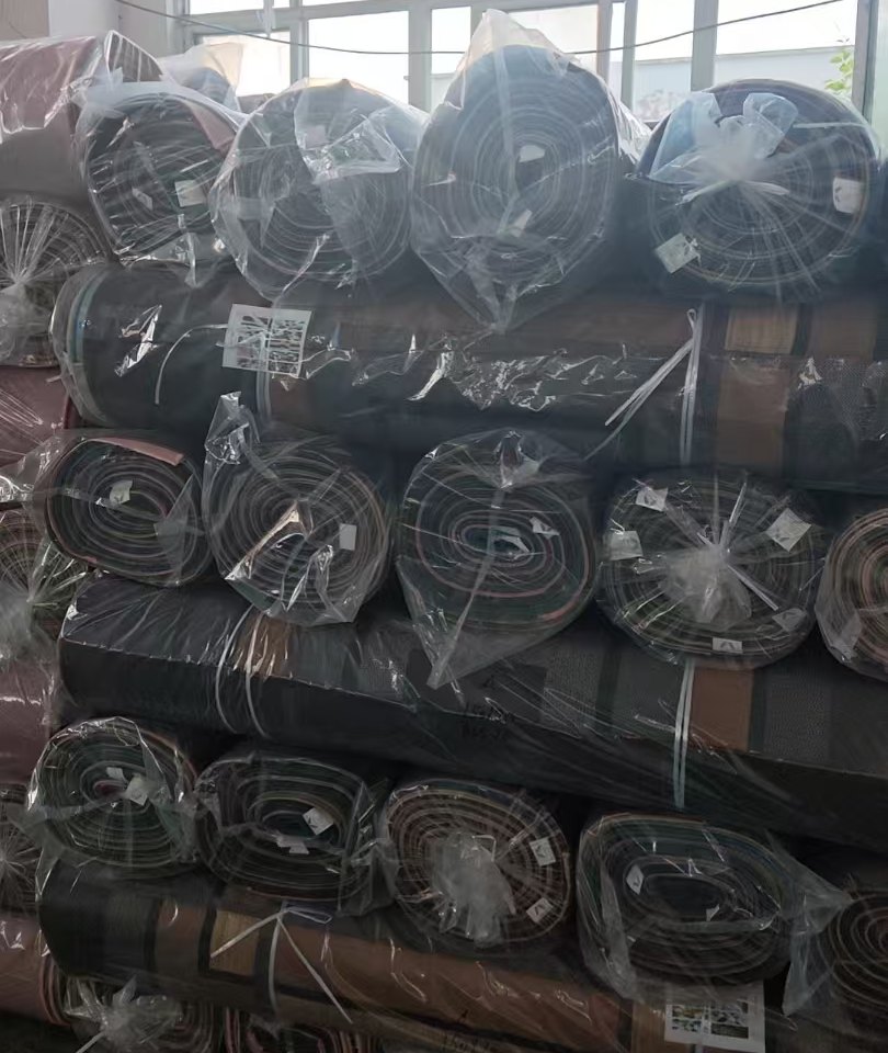 Warehouse stacked rug rolls