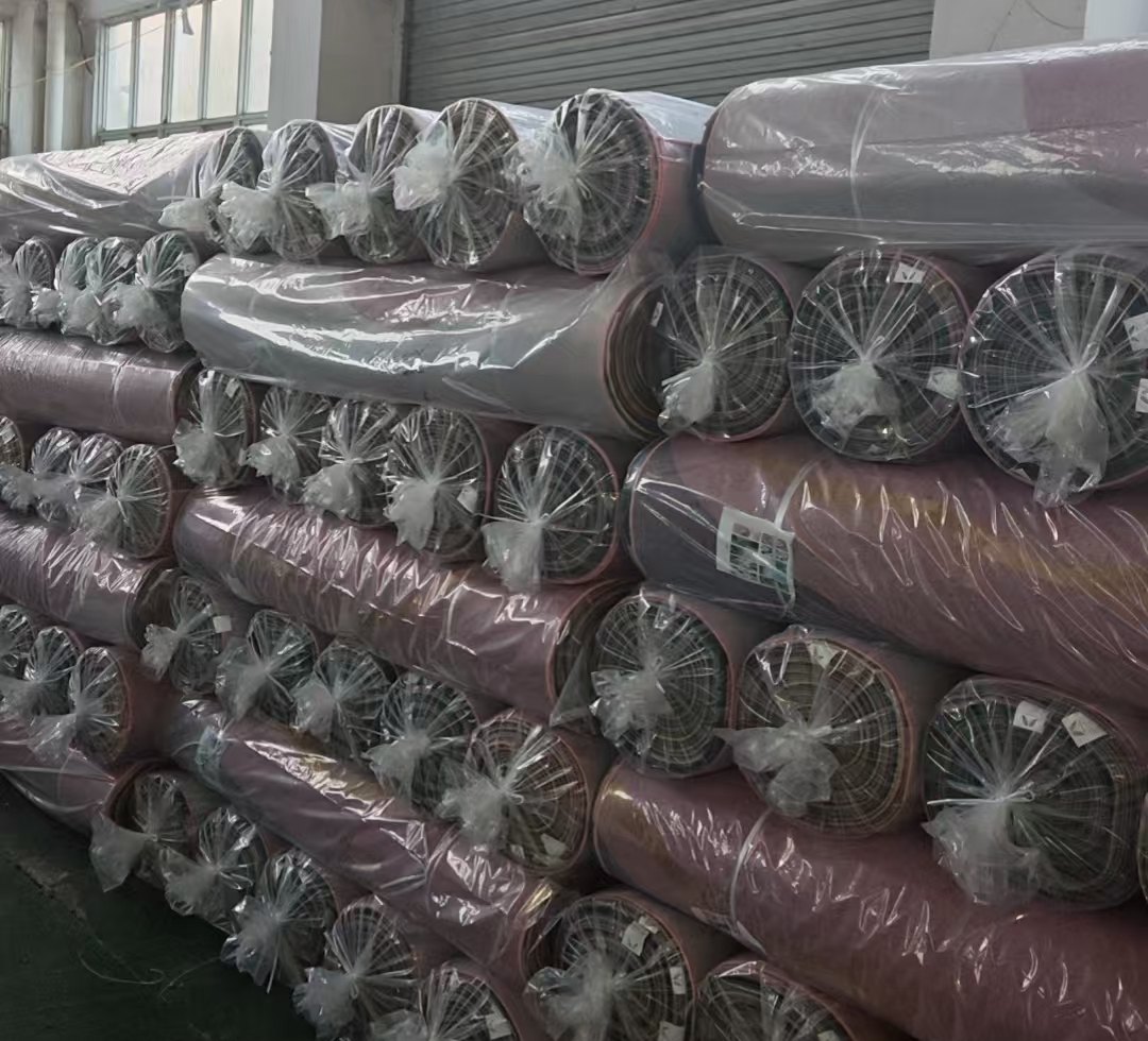 Packed rolls of rug products in storage